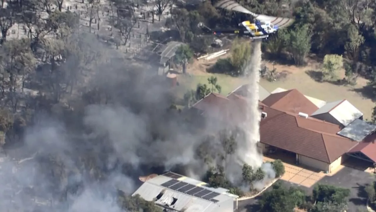 Fire crews battle large bushfire in Perth's north-east