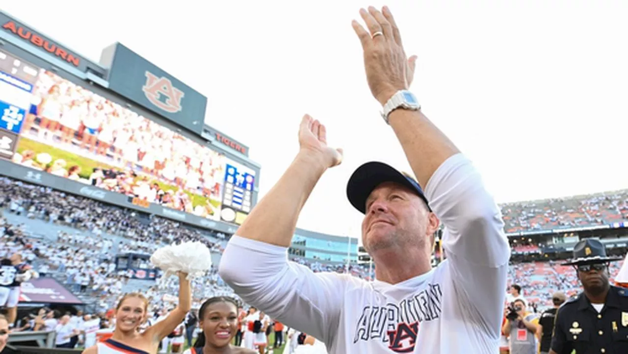 Watch as Auburn’s Freeze surprises player with visit from family, awards him football scholarship