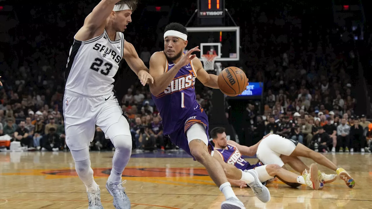 Wembanyama scores 38 points, shines in 4th quarter, as Spurs hold off Suns 132-121