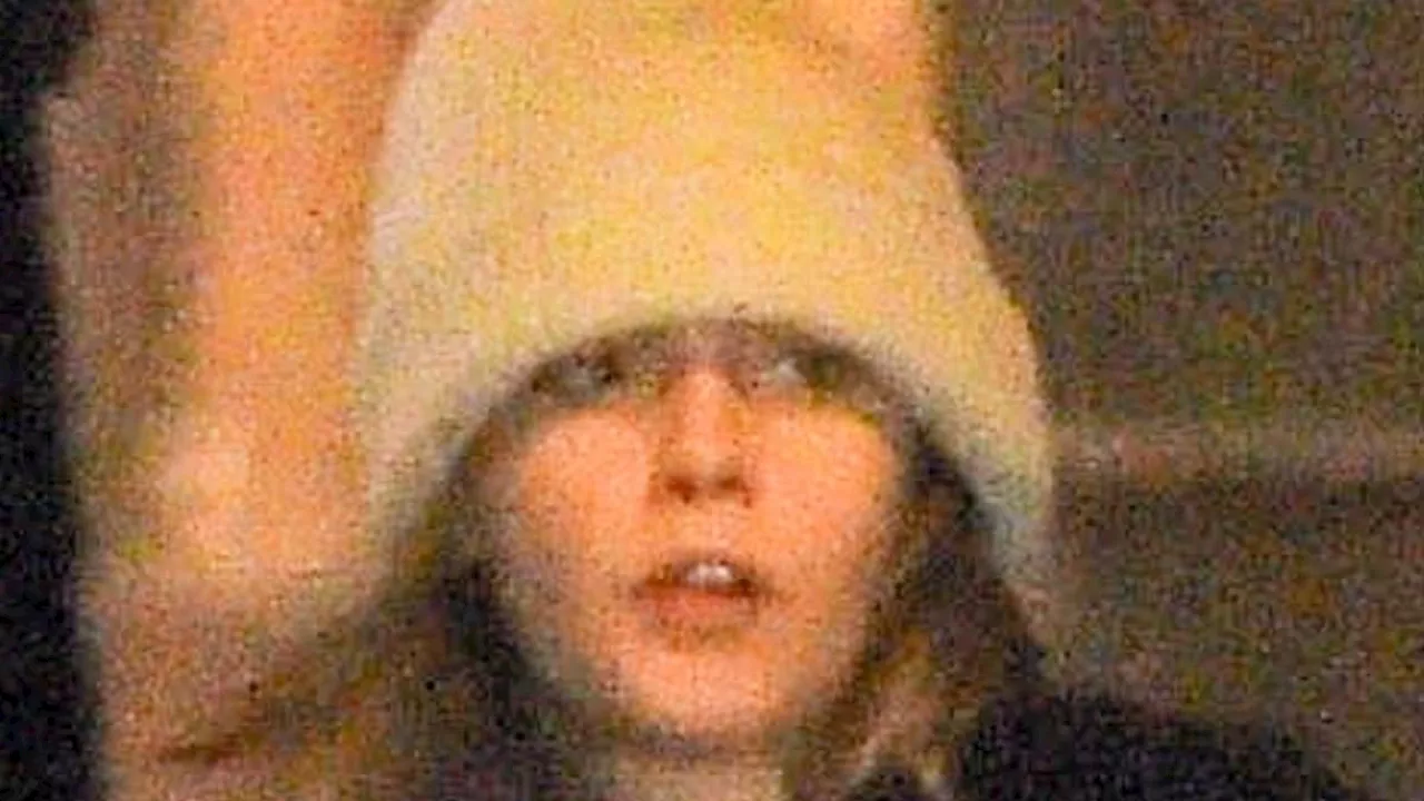 Cara Delevingne rocks an oversized beige beanie as she visits friend Taylor Swift at her New York...