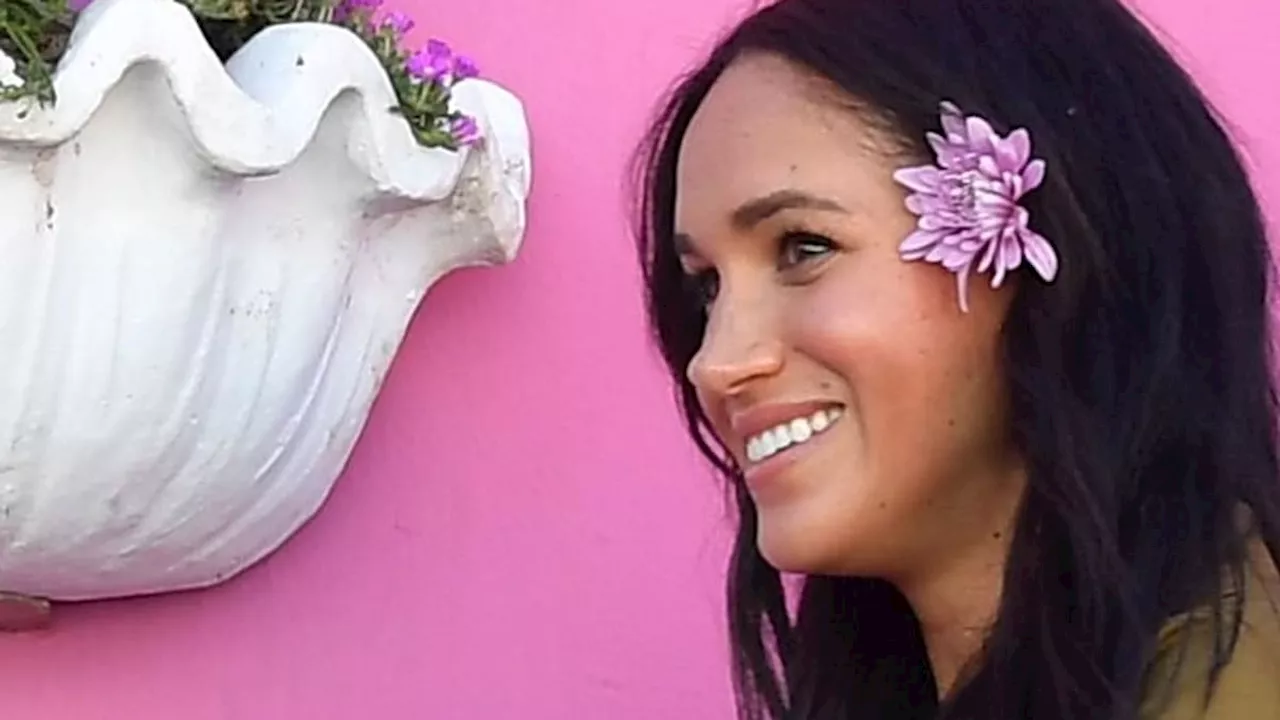 Meghan Markle is a beach babe in scalloped swimsuit in ultra-rare holiday video