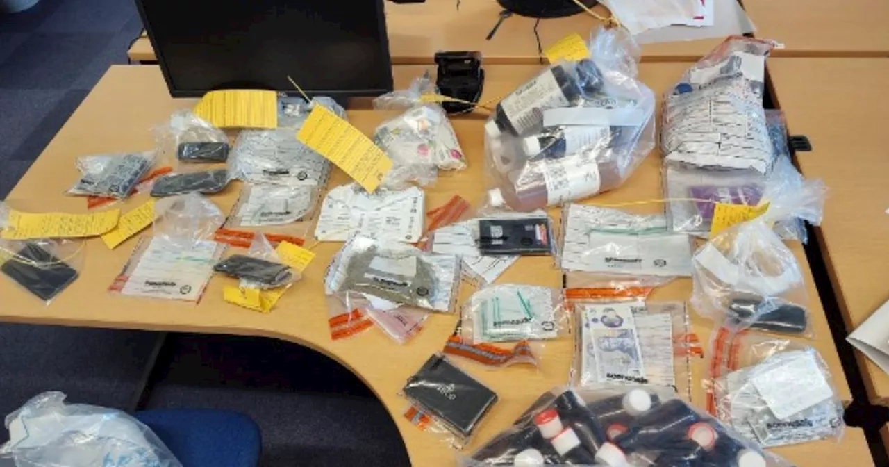 Police officers storm property and discover suspected drugs and fake money