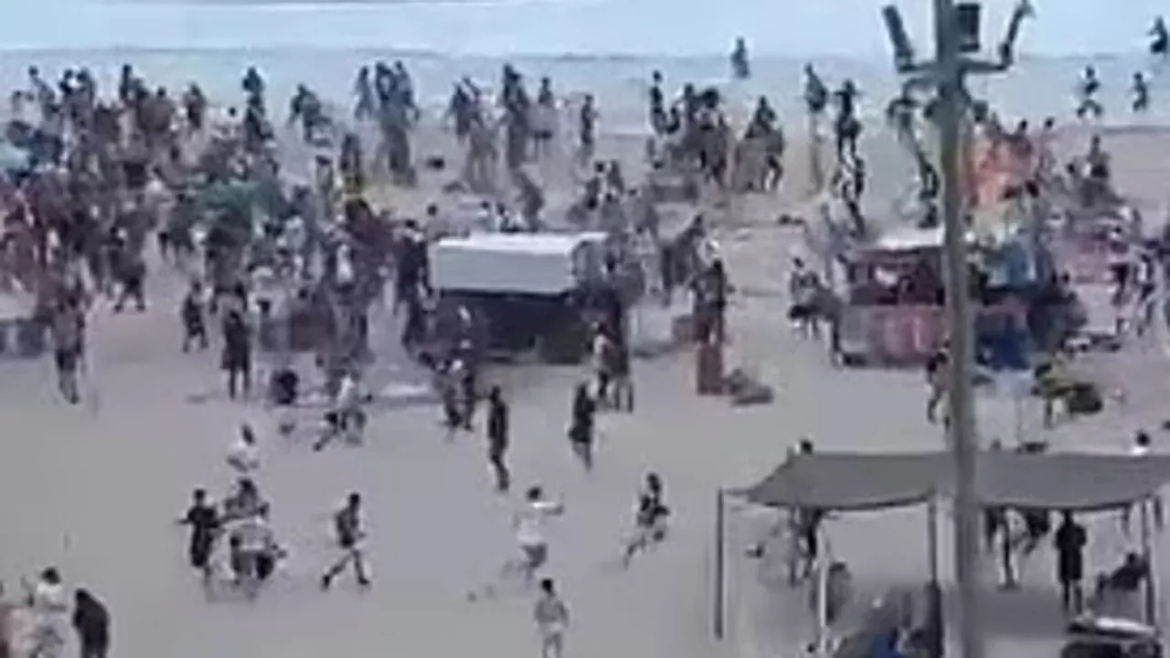 Shocking moment gigantic brawl breaks out on world’s most famous beach after fan ‘ambush’ before Copa Liber...