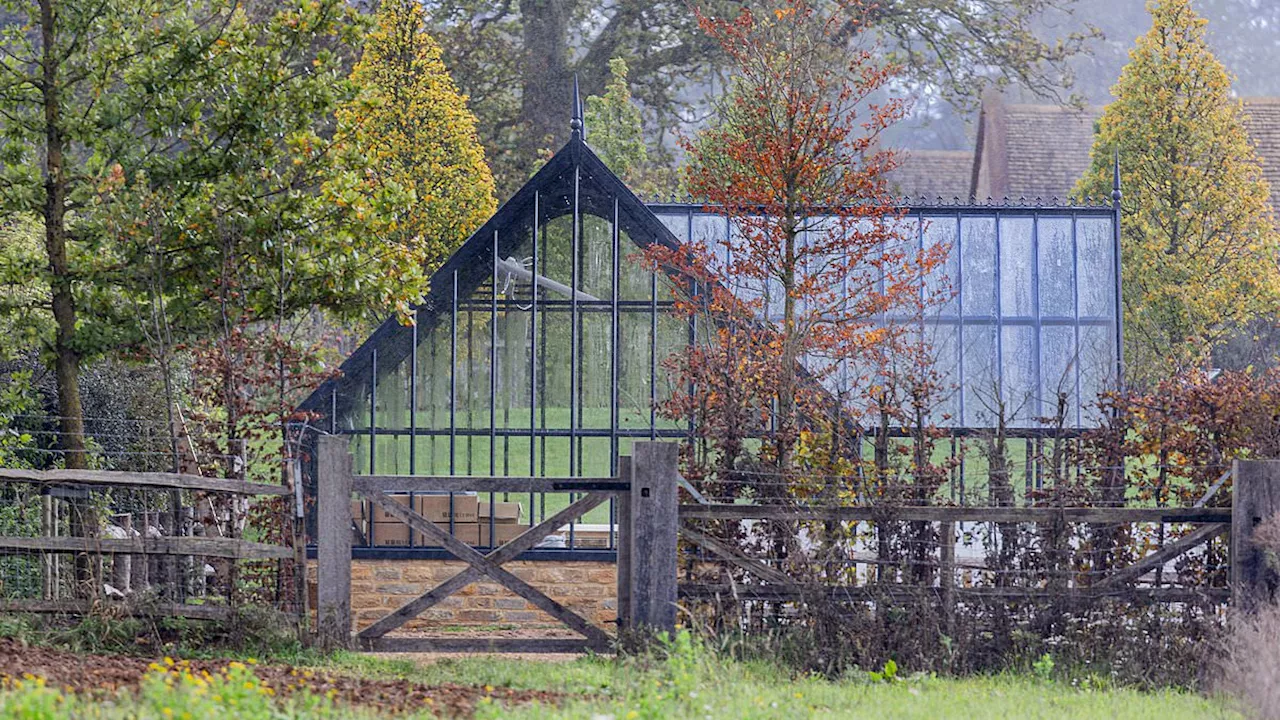 David and Victoria Beckham's flashy new glasshouse is seen on the grounds of their Cotswolds home in...