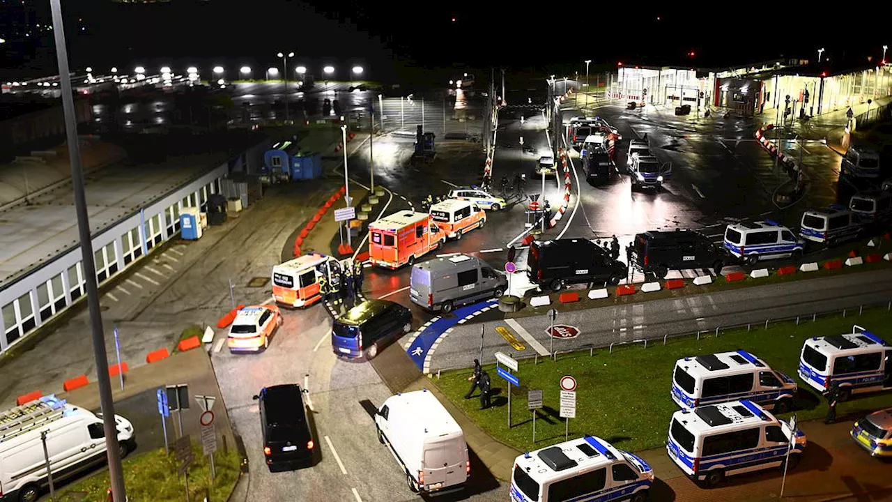 Hamburg airport is closed over 'hostage situation' after armed man 'rammed car through gate with two...