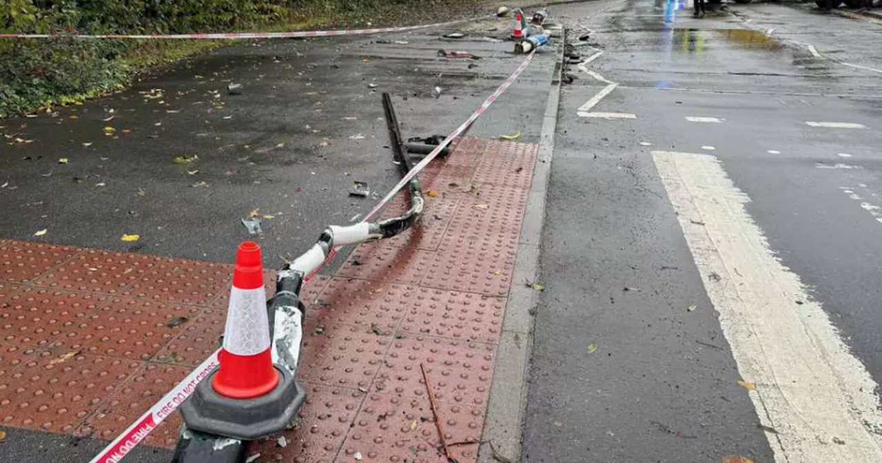 Lorry crashes into garden wall, hitting lamppost and bollards