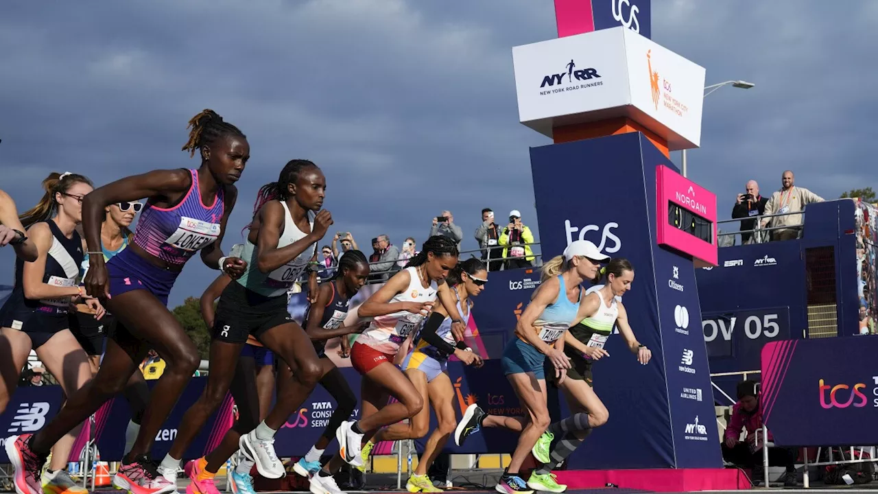 Tola sets NYC Marathon course record to win men's race; Hellen Obiri of Kenya takes women's title