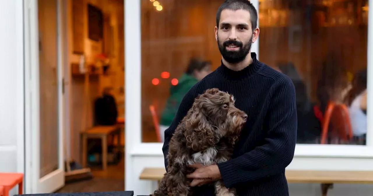 The man and his dog behind popular café bar that's bringing people together