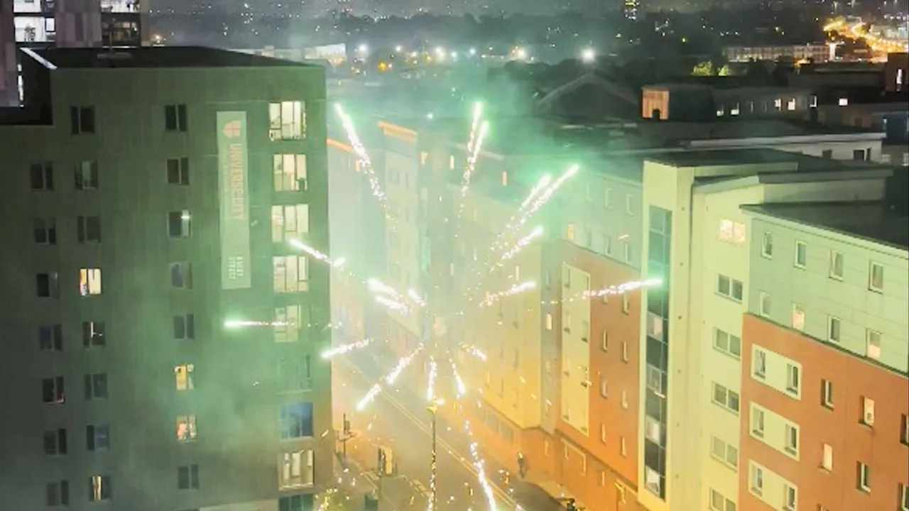 Shocking moment gang aim torrent of fireworks at each other in a Birmingham housing estate