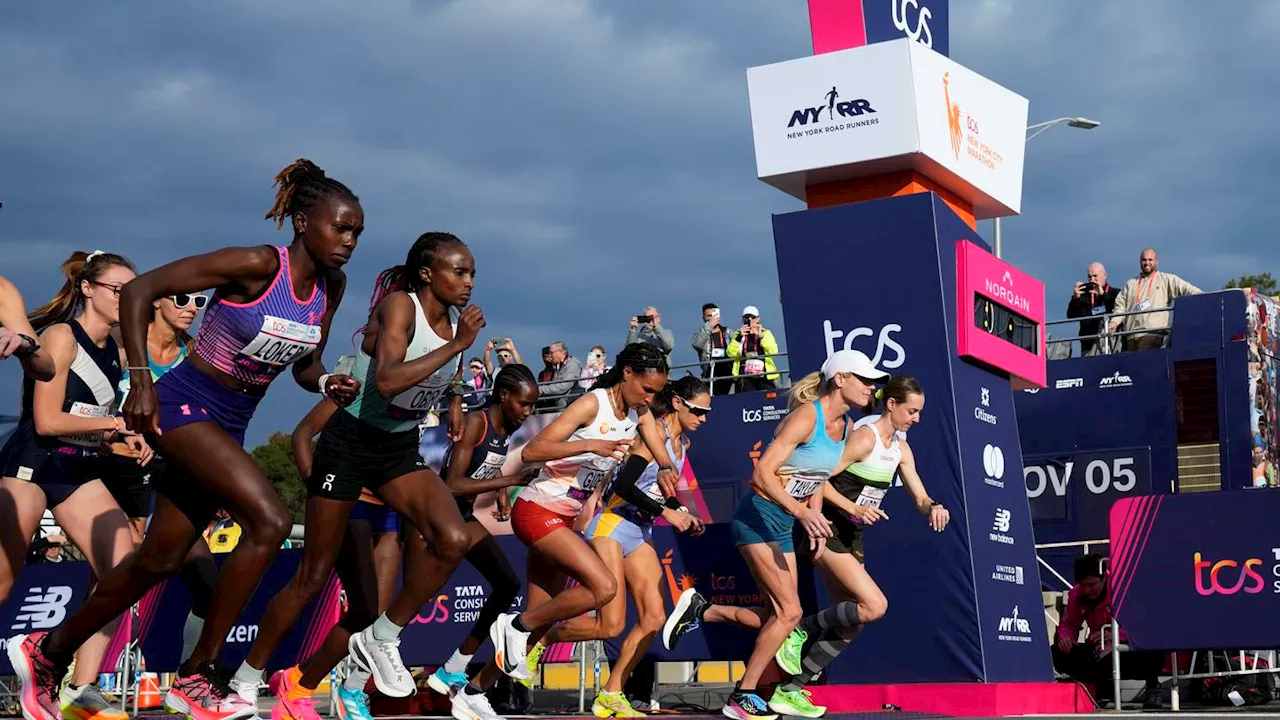 Tola sets NYC Marathon course record to win men's race; Hellen Obiri of Kenya takes women's title