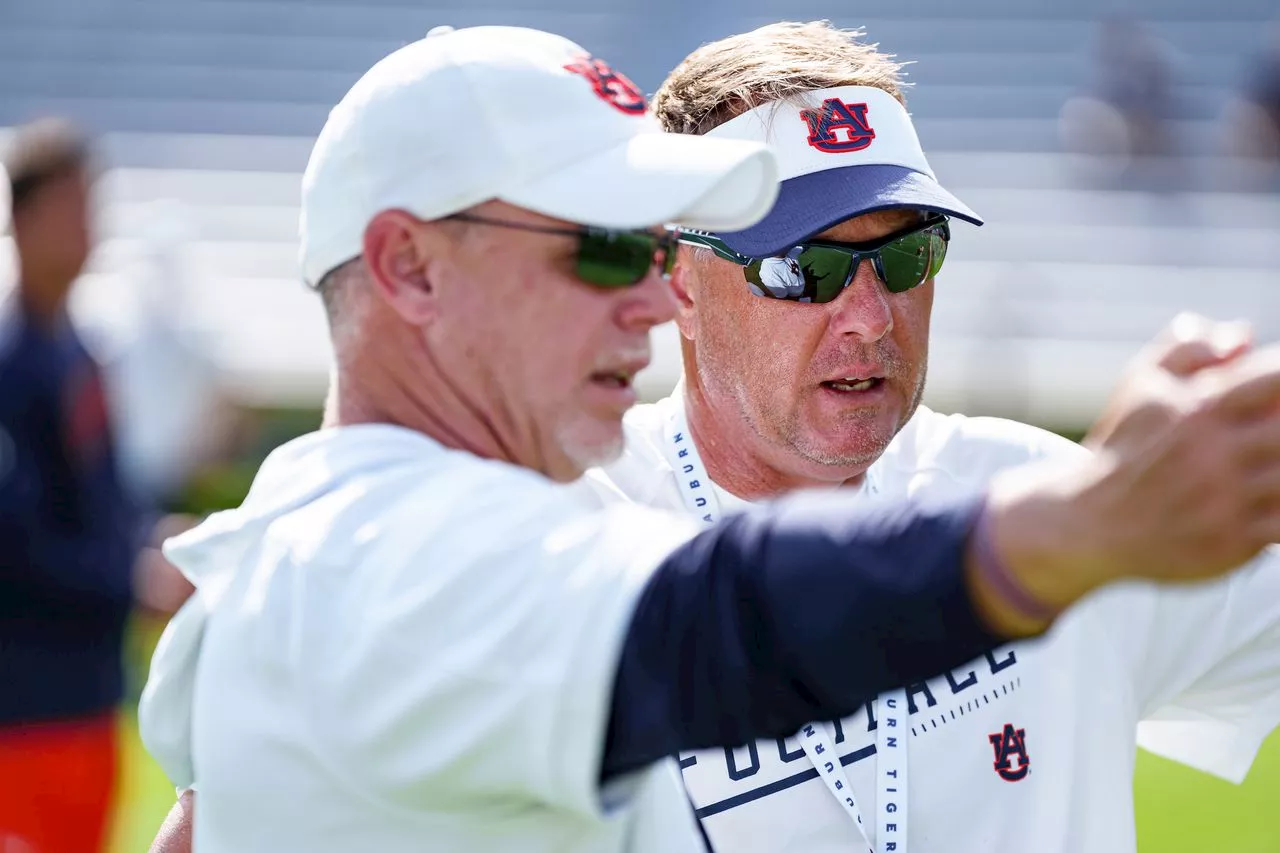 Who is calling plays at Auburn and how much does Hugh Freeze trust Philip Montgomery?