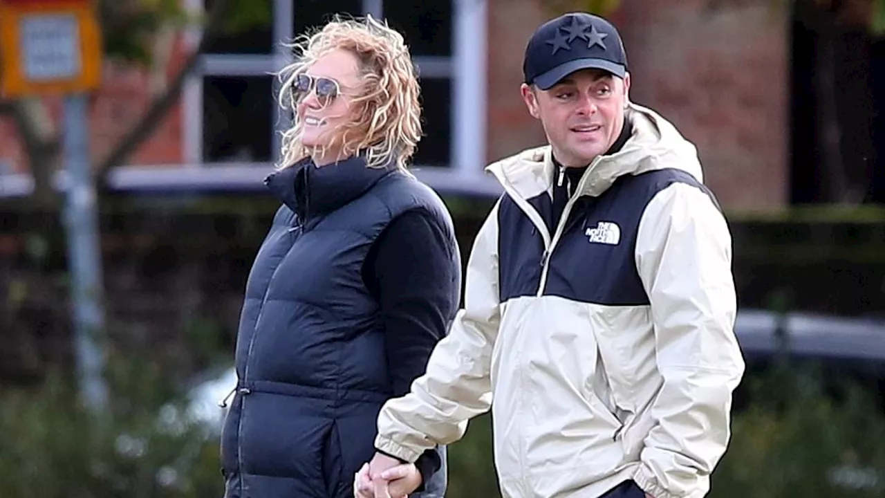 Ant McPartlin and wife Anne-Marie Corbett put on a loved-up display as they wrap up warm to walk...