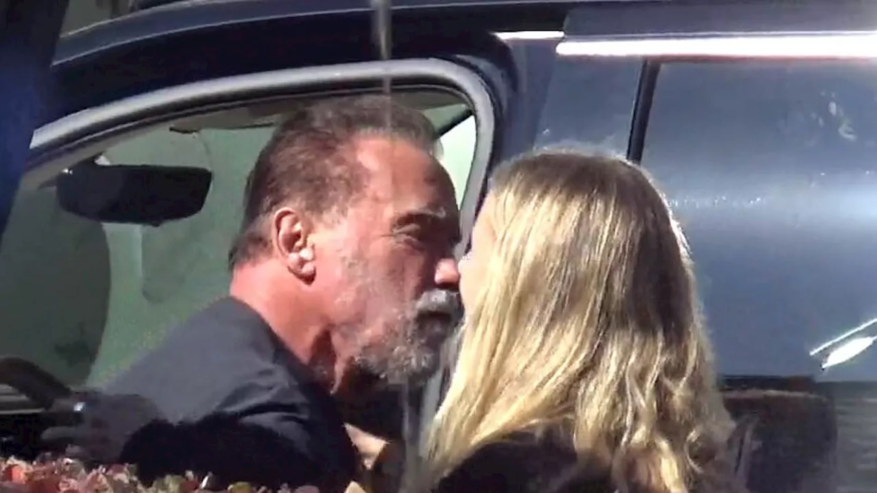 Arnold Schwarzenegger appears to kiss mystery woman following a bicycle ride in Santa Monica ......