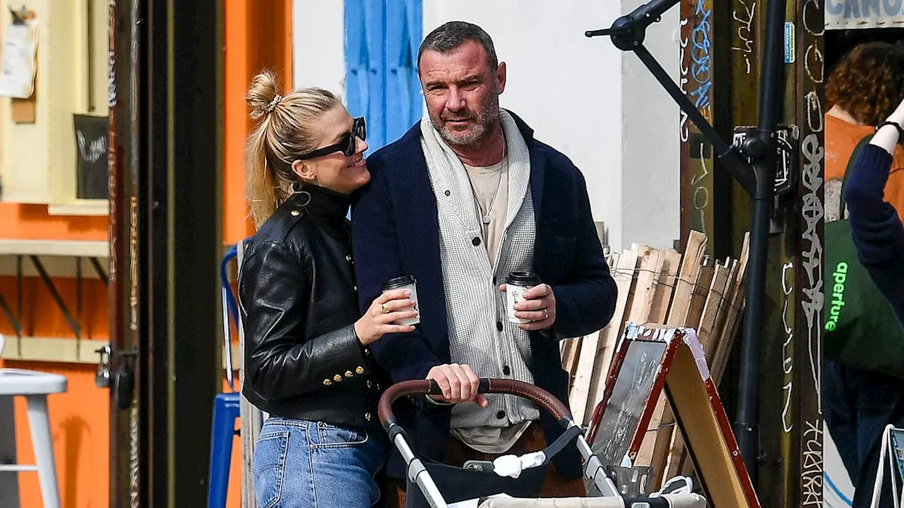 Liev Schreiber, 56, and wife Taylor Neisen, 31, look loved up as they take newborn daughter Hazel...