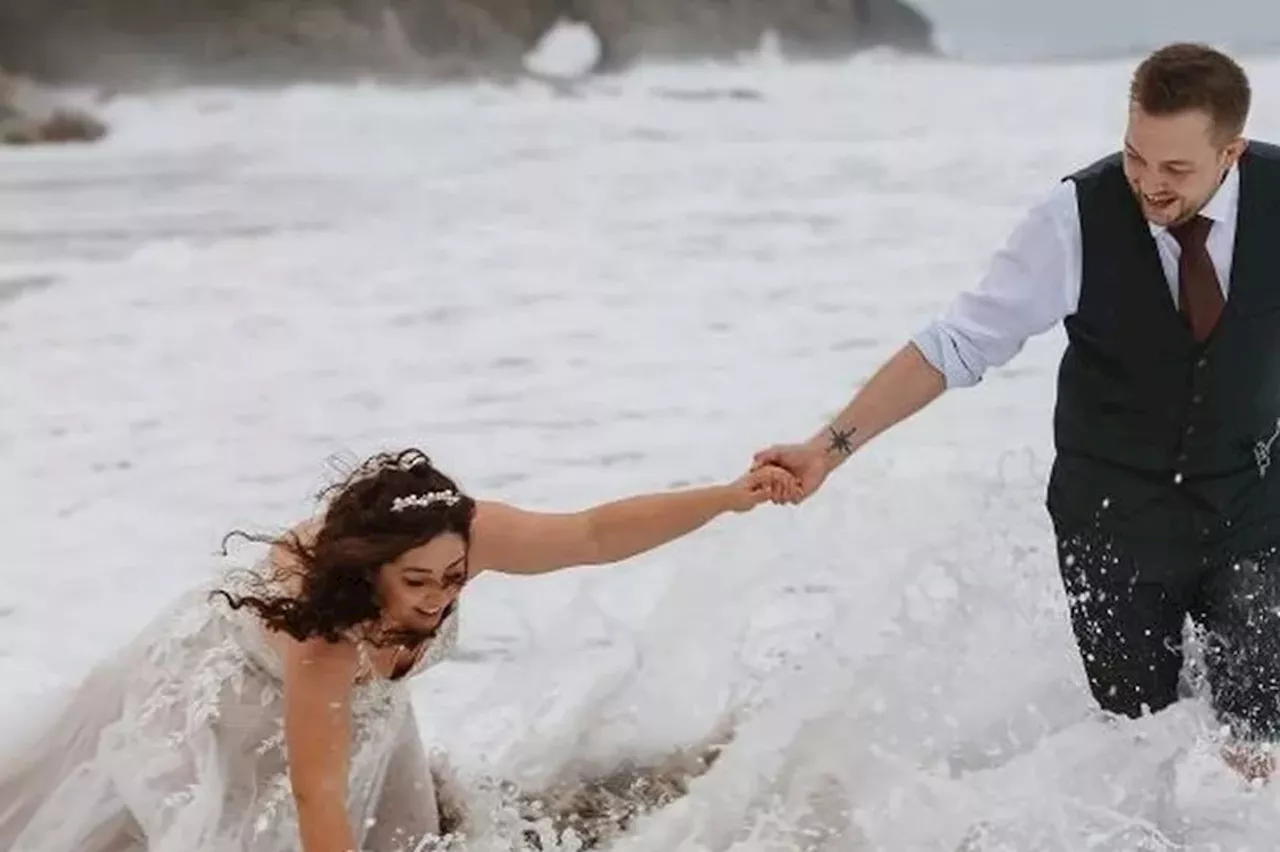 Bride gets a soaking on Cornish beach thanks to Storm Ciaran