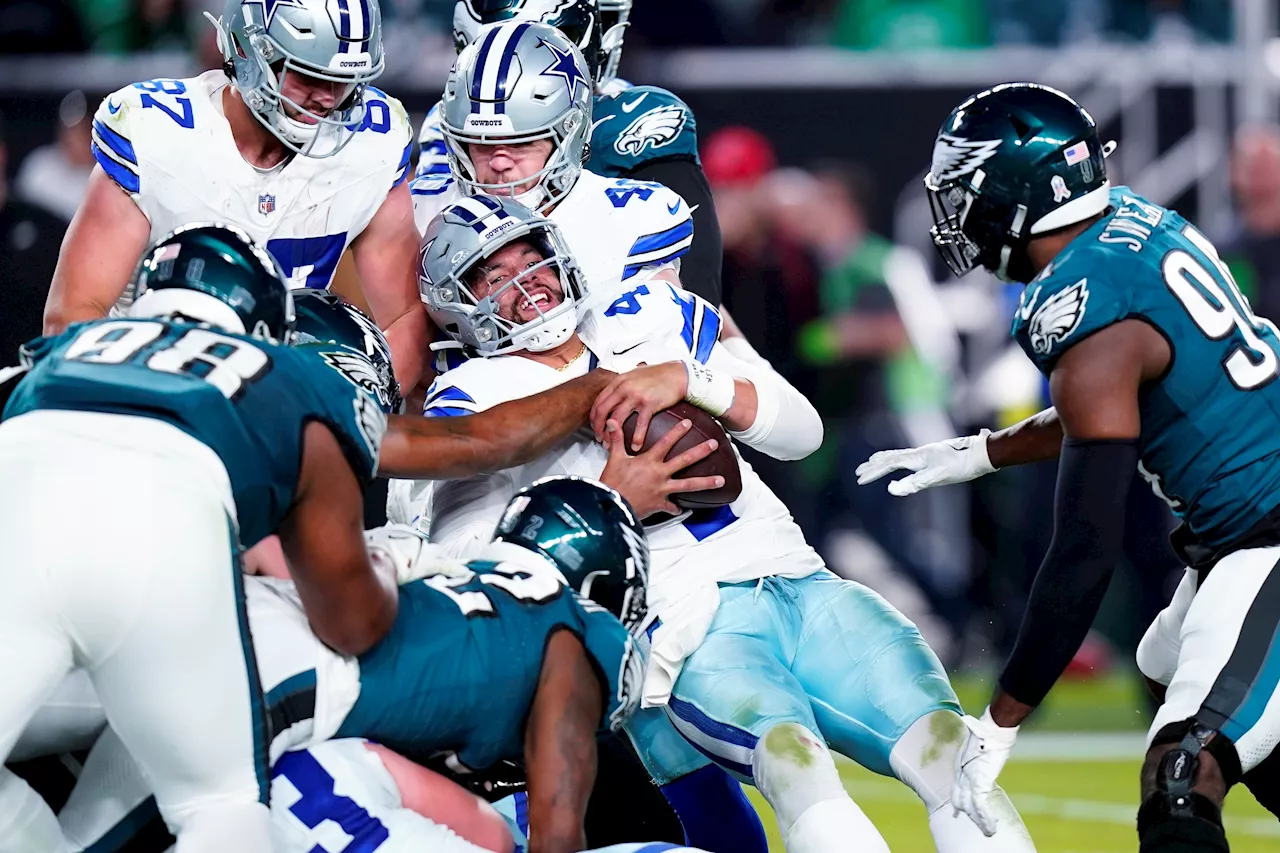 Jalen Hurts shakes off knee injury and leads Eagles past Cowboys 28-23 for NFL best 8-1 mark