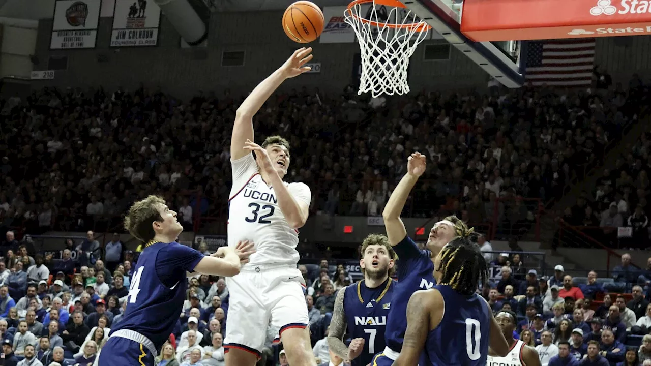 No. 6 UConn unveils its 5th championship banner, routs Northern Arizona 95-52 in season opener