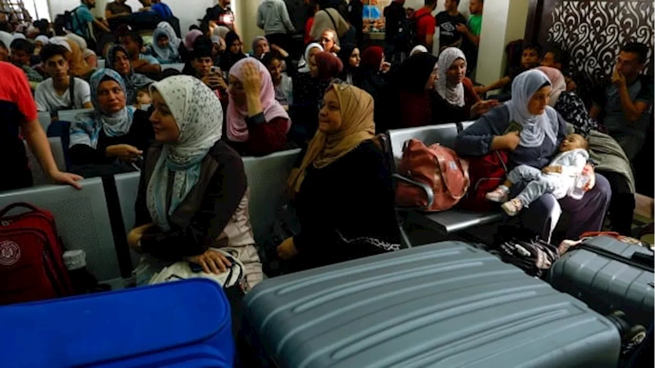 Canadians leaving Gaza Strip mourn dead family members, destroyed homes