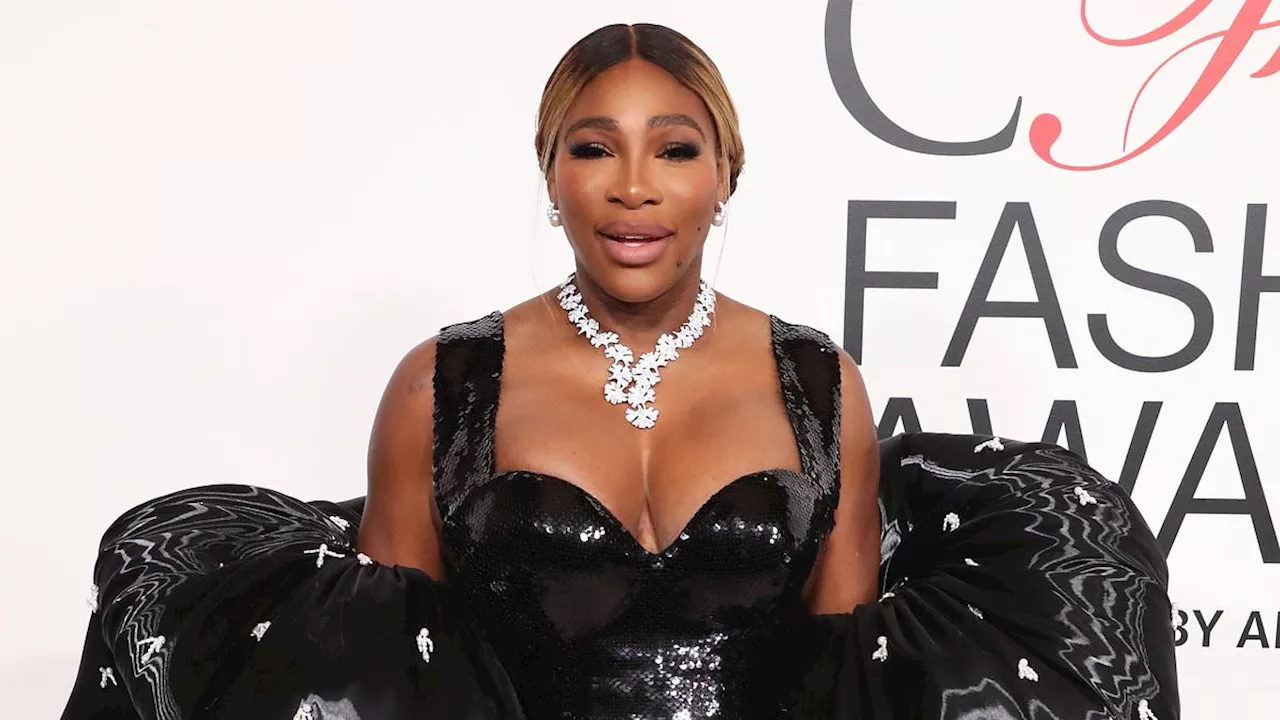 Serena Williams puts on a VERY busty display in a black sequined gown at the CFDA Fashion Awards......