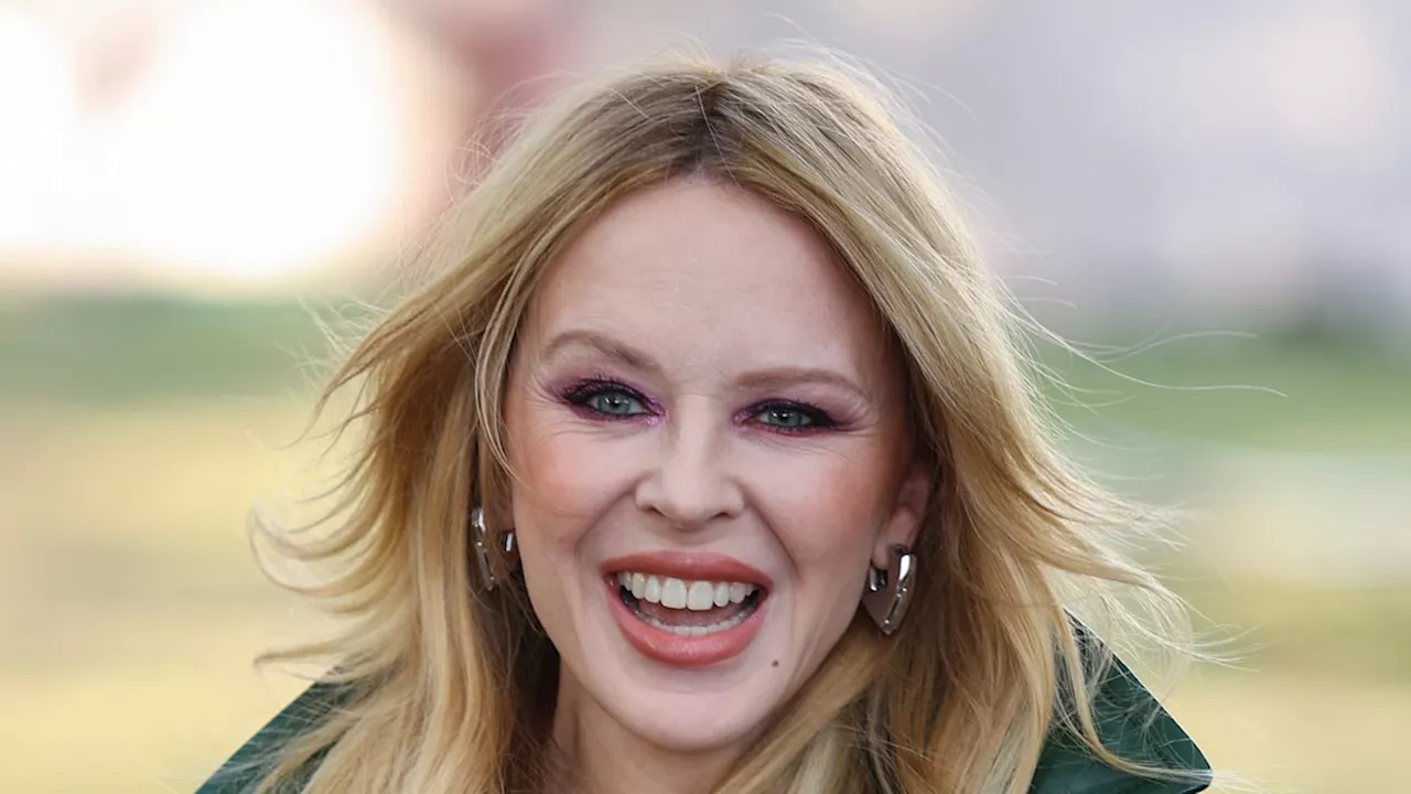 Kylie Minogue poses in cheeky bathrobe for 'wedding' photo - but it's not what you think