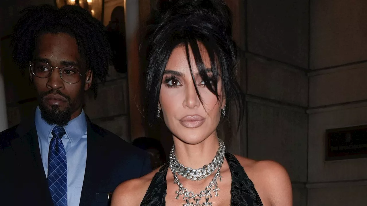 The Neckline of Kim Kardashian’s Lace-Up Crop Top Nearly Plunged to Her Belly Button