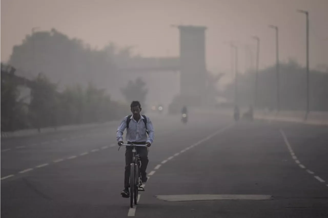 Masks are back, construction banned and schools shut as toxic air engulfs New Delhi