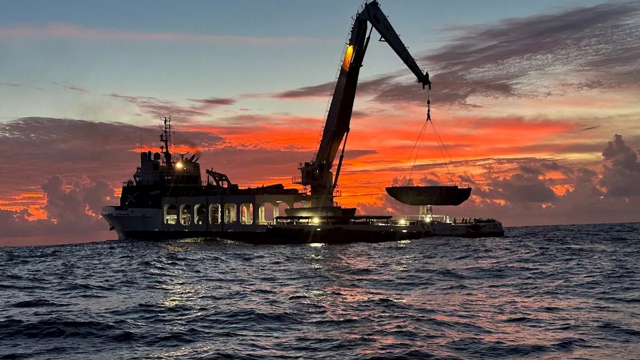 SpaceX fishes Falcon 9 payload fairing out the sea at sunrise (photo)