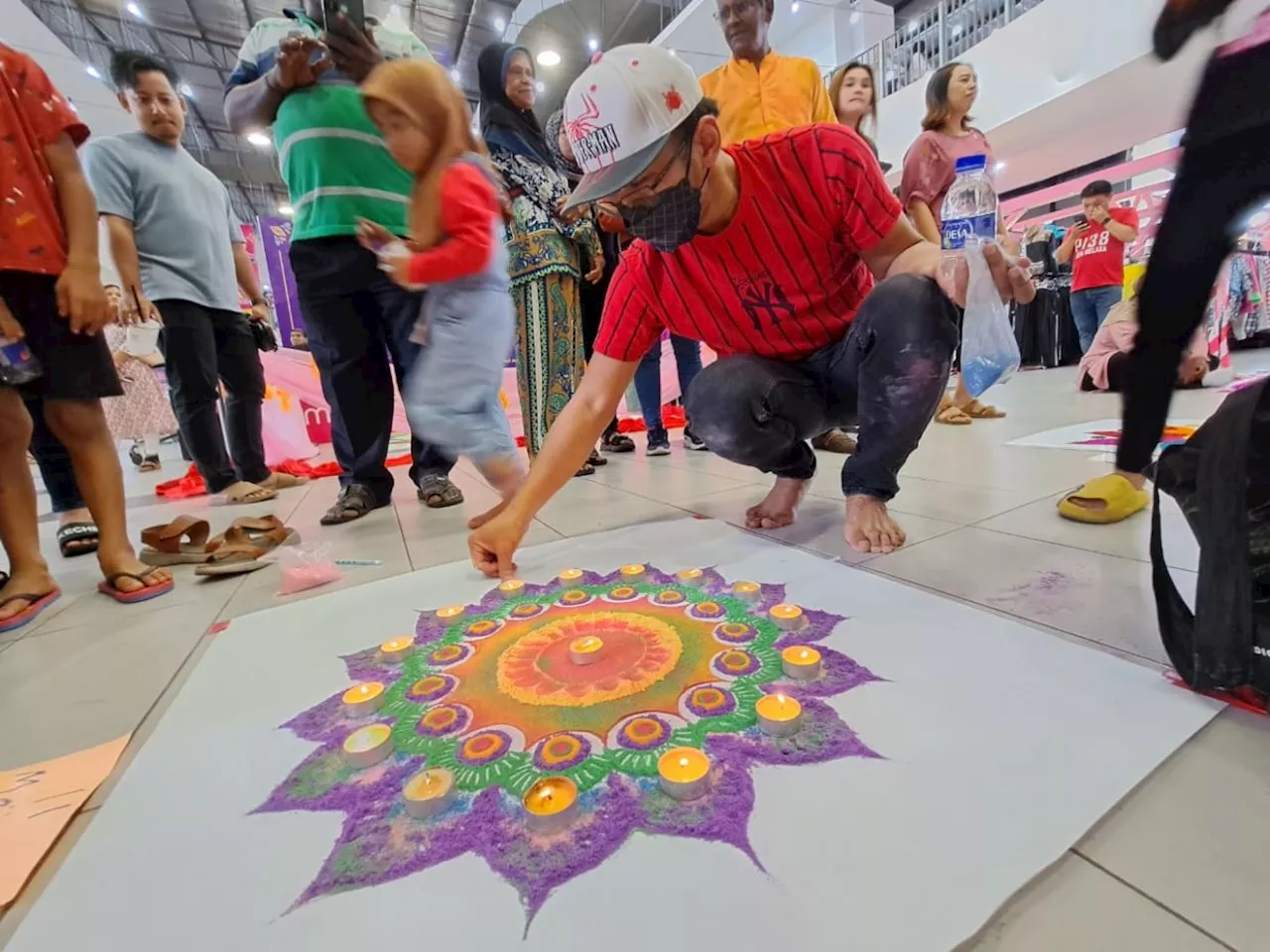 Project engineer turns out to be 'thorn among roses' at Melaka kolam drawing competition