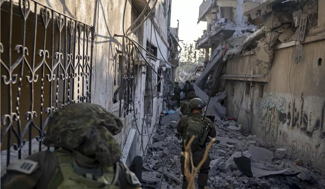 A month after Hamas' bloody rampage, Israeli troops push deeper into Gaza