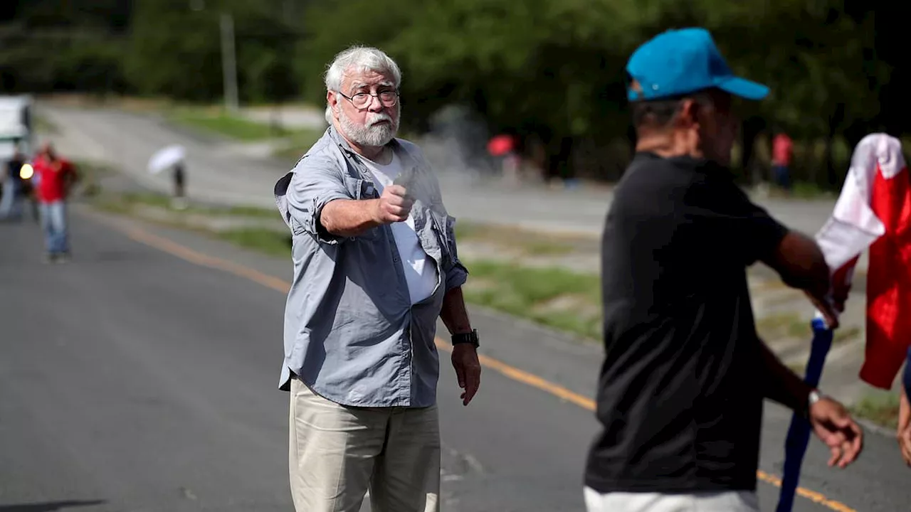 Motorist shoots dead two environmental protesters blocking a road: Driver caught in traffic gets out...