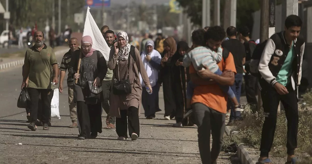 Thousands flee northern Gaza on foot as desperation grows and Israeli troops advance