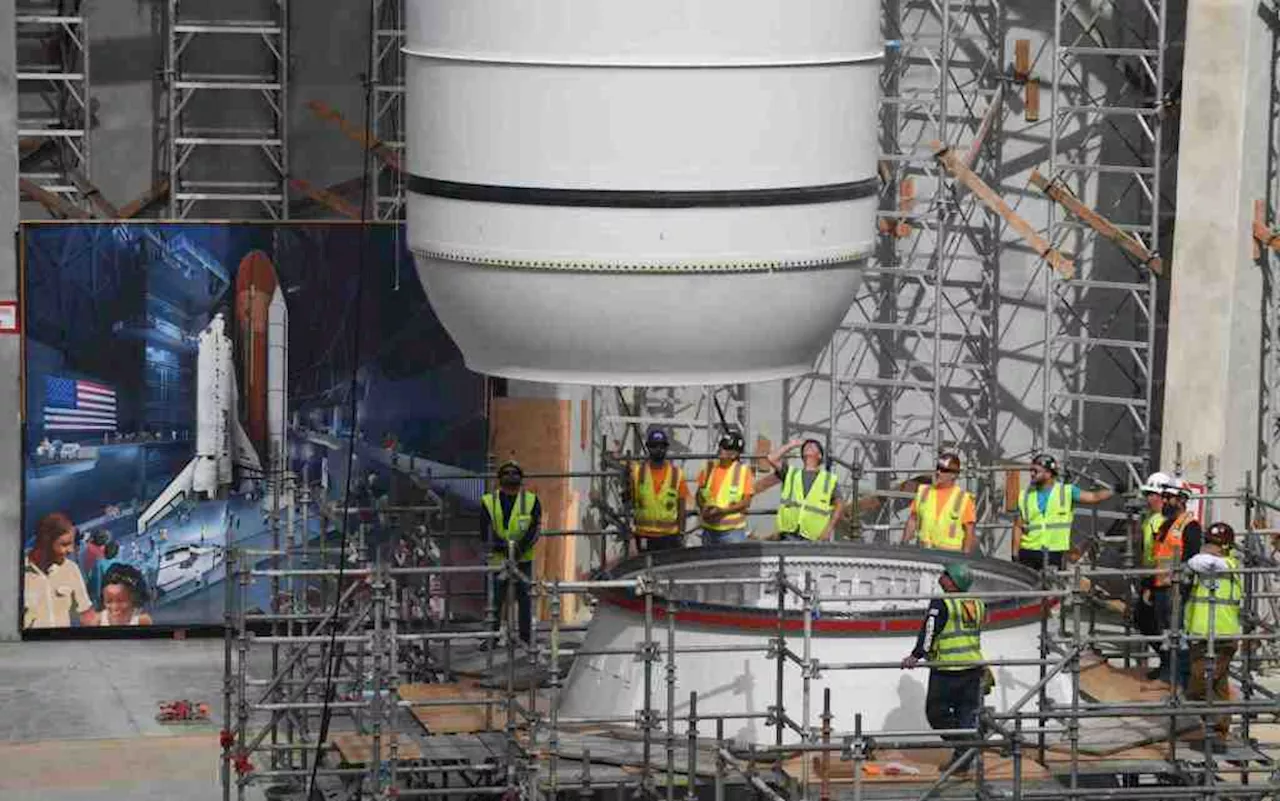 Space Shuttle Endeavour solid rocket motor is hoisted into place at California Science Center