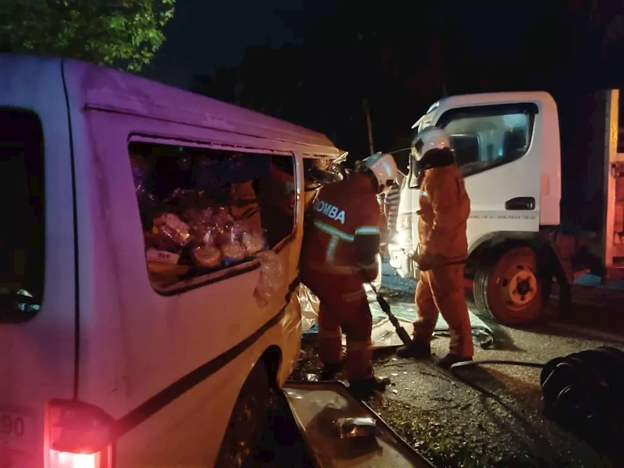 Firemen free van driver from wreckage after crash in Kuala Selangor