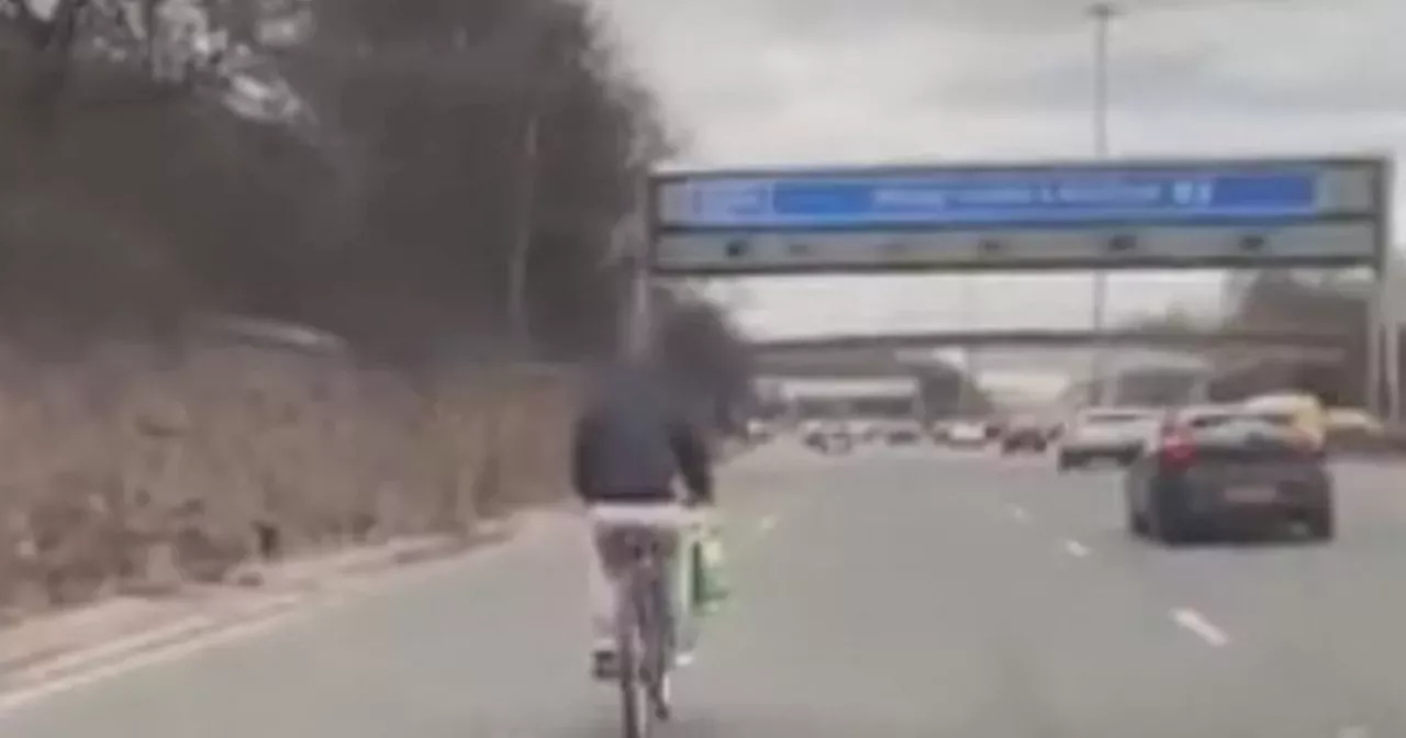 Cyclist dangerously merges with traffic on M8 in Glasgow