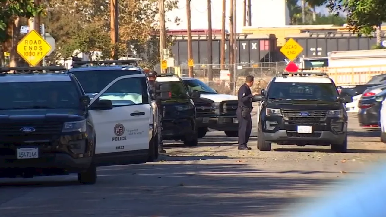 Police investigate two potentially linked crime scenes that had a Van Nuys neighborhood on lockdown