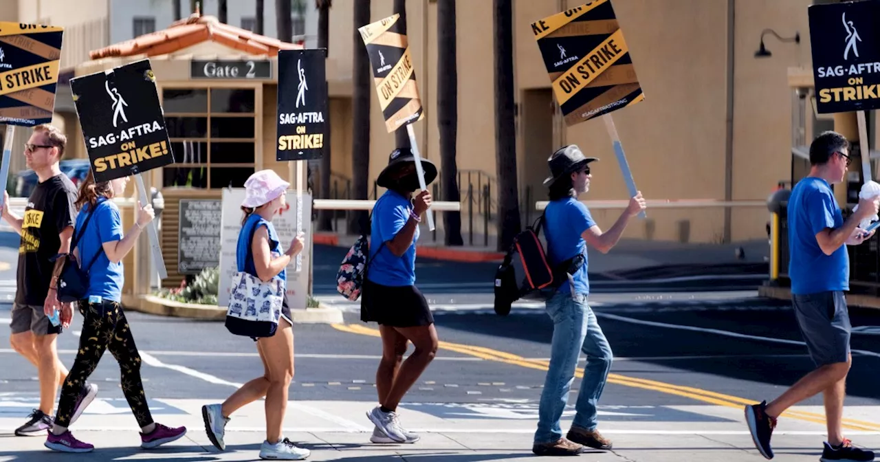 SAG-AFTRA and Hollywood studios reach a tentative agreement to resolve the strike