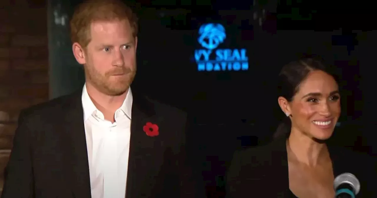 Prince Harry looks sombre alongside a beaming Meghan Markle