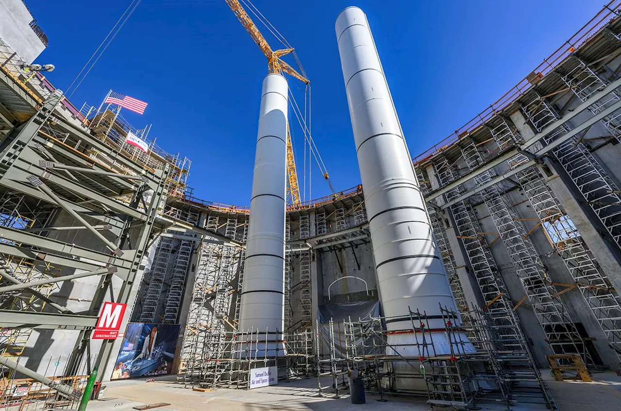 2nd rocket booster lifted into place for space shuttle Endeavour LA exhibit