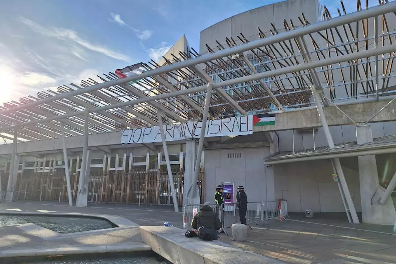 Pro-Palestine protesters climb on top of Scottish Parliament