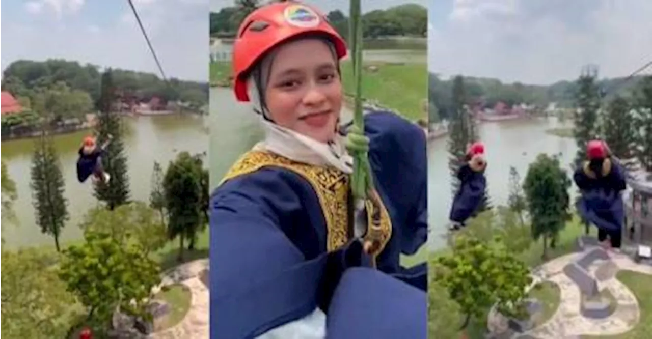 Shah Alam university graduates celebrate by ziplining in graduation robes