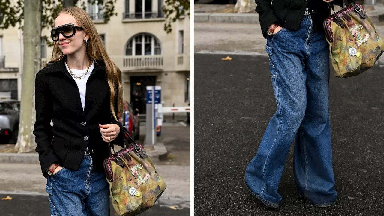 Cómo llevar baggy jeans con camiseta blanca y chamarra negra en otoño 2023