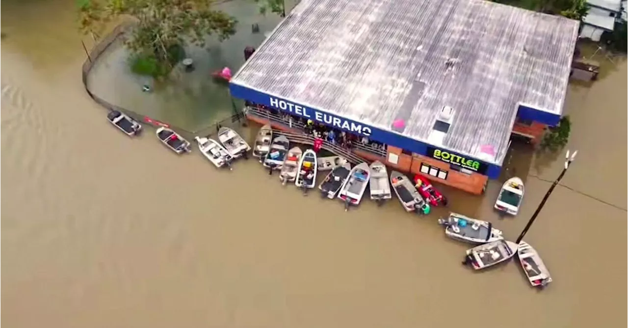 Severe weather warning cancelled but risk remains in flood-hit Queensland