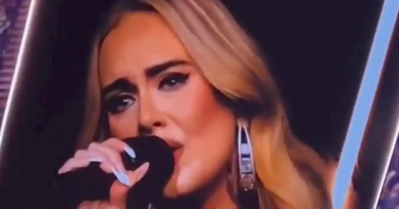 Adele breaks down in tears on stage as fan shows her photo of his late wife