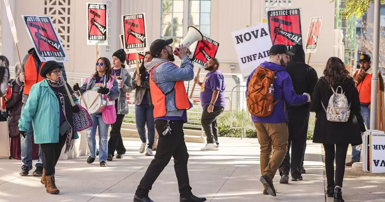 Amid ongoing labor dispute, fired county janitors get their jobs back