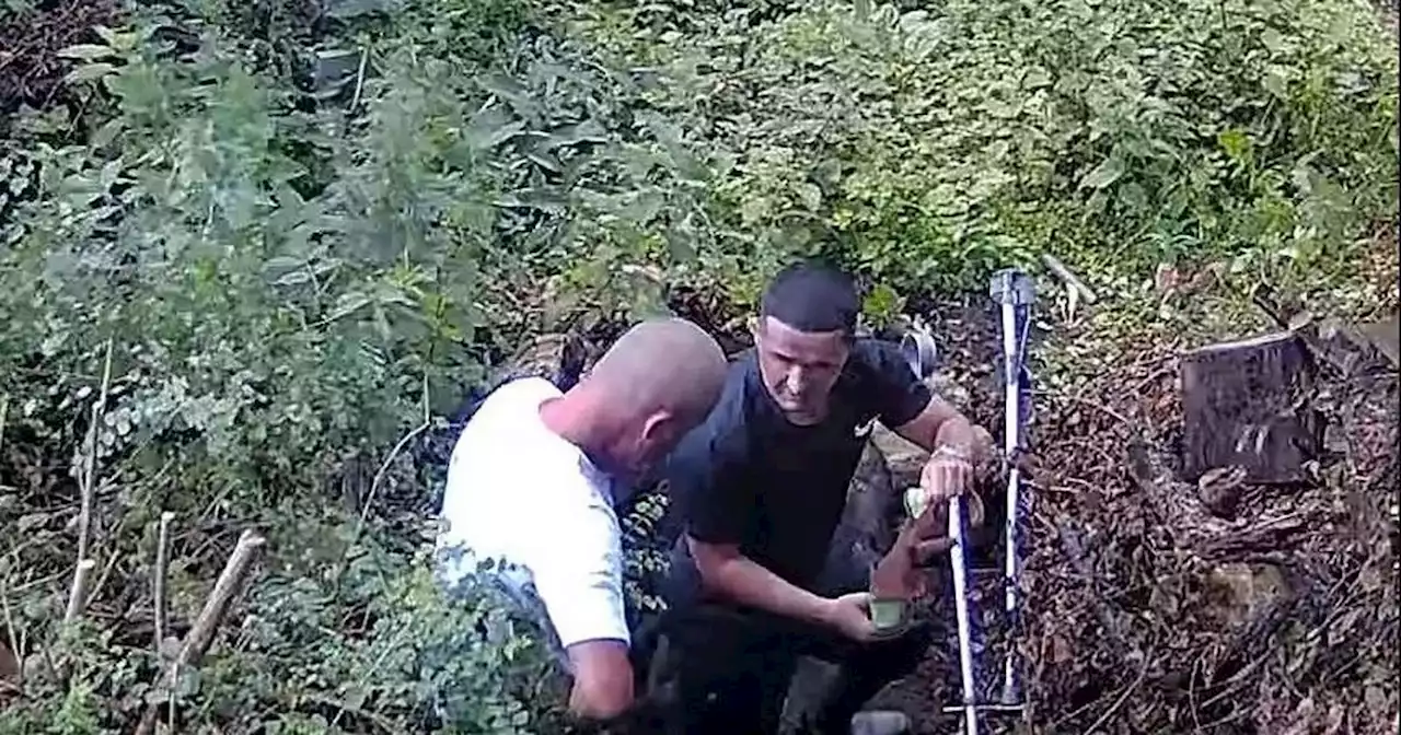 Dad-and-son gun runners caught by their OWN CCTV digging up weapons