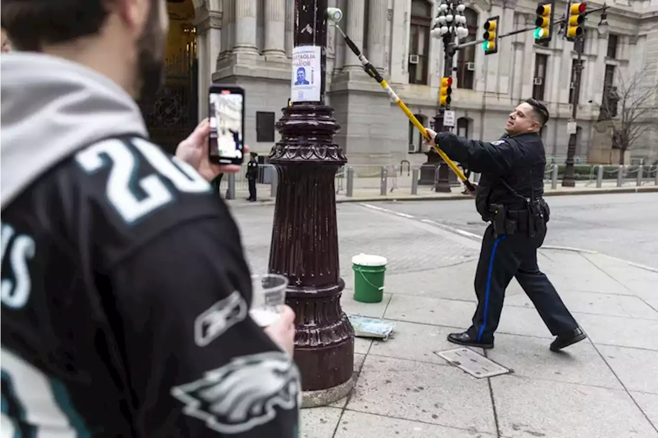 Why ‘greasing’ the poles has not stopped Eagles fans from climbing