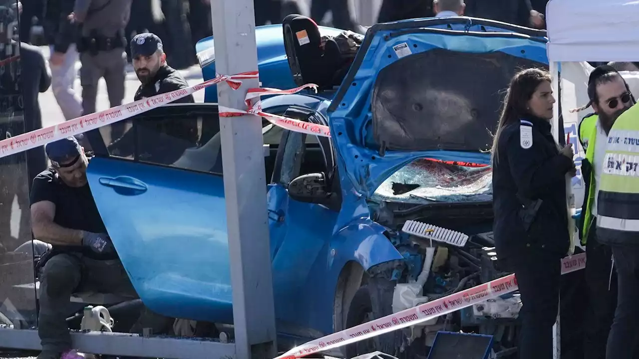 Two killed, including six-year-old boy, after car driven into crowd at Jerusalem bus stop