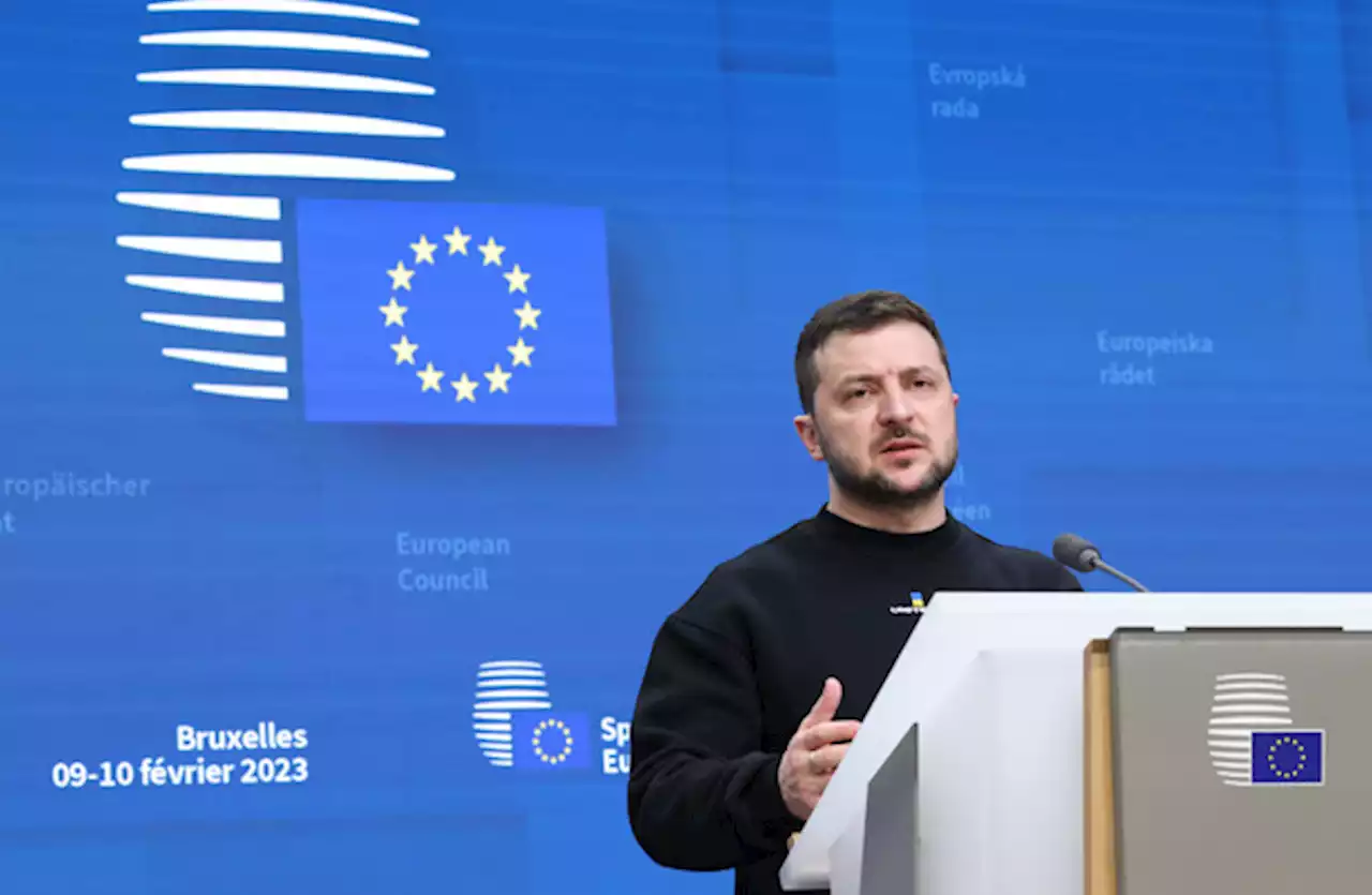 Hailed as a hero at EU summit, Zelenskyy urges faster arms supplies