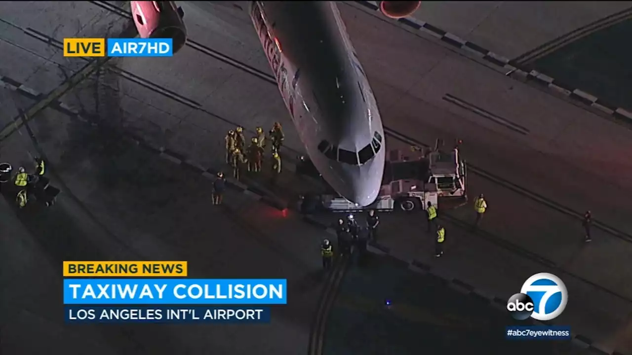 American Airlines plane and shuttle bus collide on taxiway at LAX, leaving 4 hospitalized