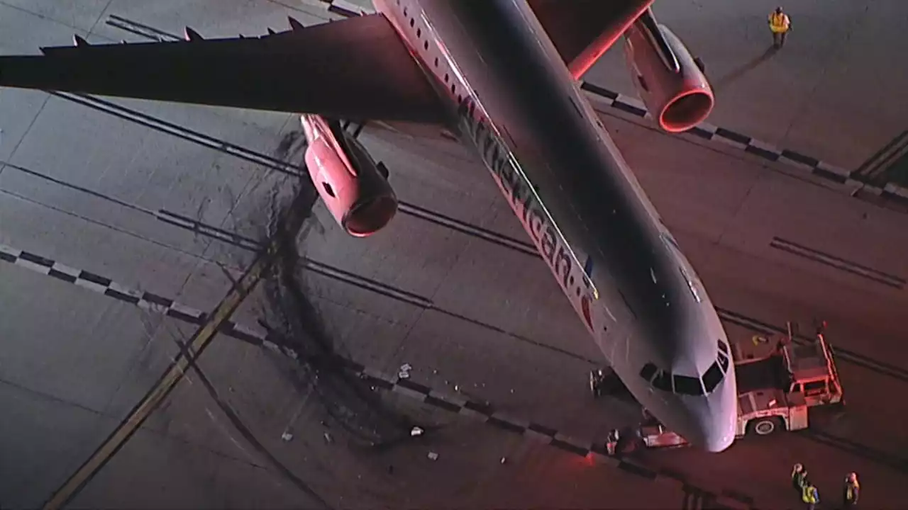 American Airlines plane and shuttle bus collide on taxiway at LAX, leaving 4 hospitalized